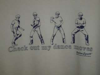    Napoleon Dynamite Check out my dance moves shirt white: Clothing