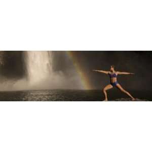 Young Woman Practicing Yoga on a Rock, Snoqualmie Falls, Washington 