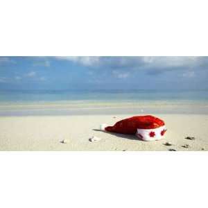  Christmas Hat on a White Sandy Beach in the Indian Ocean 