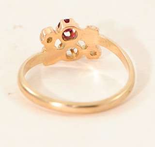 diamond, ruby and pearl ring made in 14 carat rose gold and dating 