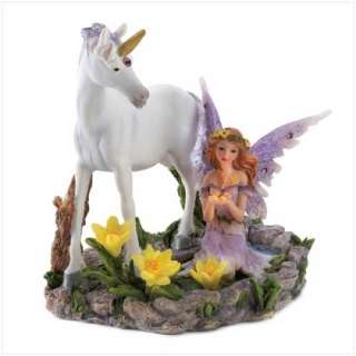 fair haired fairy pauses by a clear forest pool, her unicorn 