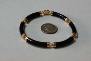 Curved Onyx bangle style bracelet with 14k gold Asian charactor.NR 