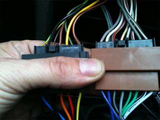   is done between the wiring harness adaptor and car wiring loom